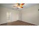 Bright bedroom with wood-look floors and access to bathroom at 211 Shell Creek Ct, Apollo Beach, FL 33572