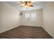Bright bedroom with ceiling fan and wood-look floors at 211 Shell Creek Ct, Apollo Beach, FL 33572