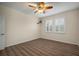 Spacious bedroom with wood-look floors and ceiling fan at 211 Shell Creek Ct, Apollo Beach, FL 33572