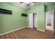 Spacious bedroom with wood floors and large closet at 211 Shell Creek Ct, Apollo Beach, FL 33572