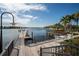 Wooden community dock with seating and kayak storage at 211 Shell Creek Ct, Apollo Beach, FL 33572