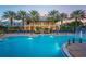 Resort-style pool with a clubhouse and palm trees at 211 Shell Creek Ct, Apollo Beach, FL 33572