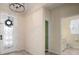 Bright entryway with elegant front door and adjacent bathroom at 211 Shell Creek Ct, Apollo Beach, FL 33572