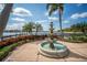 Ornate fountain with lush landscaping and lake views at 211 Shell Creek Ct, Apollo Beach, FL 33572