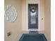 Inviting front door with a wreath and a welcome mat at 211 Shell Creek Ct, Apollo Beach, FL 33572