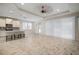 Open concept kitchen with island and breakfast bar at 211 Shell Creek Ct, Apollo Beach, FL 33572