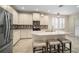 Modern kitchen with island, stainless steel appliances, and white cabinets at 211 Shell Creek Ct, Apollo Beach, FL 33572