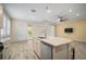 Kitchen island with sink, dishwasher, and granite countertop at 211 Shell Creek Ct, Apollo Beach, FL 33572