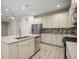 Modern kitchen with stainless steel appliances and an island at 211 Shell Creek Ct, Apollo Beach, FL 33572