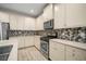 Modern kitchen with stainless steel appliances and white cabinets at 211 Shell Creek Ct, Apollo Beach, FL 33572