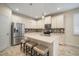 Modern kitchen with island, stainless steel appliances, and white cabinets at 211 Shell Creek Ct, Apollo Beach, FL 33572