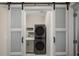 Laundry room with stackable washer and dryer at 211 Shell Creek Ct, Apollo Beach, FL 33572