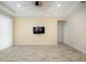 Bright living room with ceiling fan and sliding doors at 211 Shell Creek Ct, Apollo Beach, FL 33572