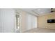 Living area with sliding glass doors and neutral walls at 211 Shell Creek Ct, Apollo Beach, FL 33572