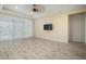 Spacious living room with wood-look tile floor at 211 Shell Creek Ct, Apollo Beach, FL 33572