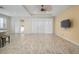 Bright living room with tile floors and sliding glass doors at 211 Shell Creek Ct, Apollo Beach, FL 33572