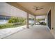 Spacious screened patio with paver floor and ceiling fan at 211 Shell Creek Ct, Apollo Beach, FL 33572