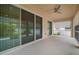 Covered patio with ceiling fan and screens at 211 Shell Creek Ct, Apollo Beach, FL 33572