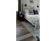 Main bedroom with coastal decor and a comfortable bed at 22481 Westchester Blvd # A23, Punta Gorda, FL 33980