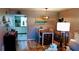 Dining area with table, chairs, and kitchen view at 22481 Westchester Blvd # A23, Punta Gorda, FL 33980