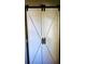 White barn doors with black accents at 22481 Westchester Blvd # A23, Punta Gorda, FL 33980