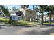 Exterior view of condo building with landscaping and parking at 22481 Westchester Blvd # A23, Punta Gorda, FL 33980
