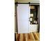 White sliding barn door reveals laundry and utilities at 22481 Westchester Blvd # A23, Punta Gorda, FL 33980