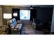 Living area featuring a gray reclining sofa and armchair at 22481 Westchester Blvd # A23, Punta Gorda, FL 33980