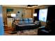 Living room with recliner sofa and floor lamp at 22481 Westchester Blvd # A23, Punta Gorda, FL 33980
