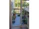 Small, private patio with potted plants and sliding glass door access at 22481 Westchester Blvd # A23, Punta Gorda, FL 33980