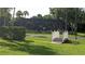 Community pool area with a footbridge and lush landscaping at 22481 Westchester Blvd # A23, Punta Gorda, FL 33980