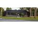 Community pool area with screened enclosure, tables, and chairs at 22481 Westchester Blvd # A23, Punta Gorda, FL 33980