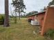 Private backyard with mature trees and open space at 2280 Toniwood Ln, Palm Harbor, FL 34685