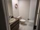 Small bathroom with single sink vanity and toilet at 2280 Toniwood Ln, Palm Harbor, FL 34685