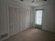 Spacious bedroom with large closet and window at 2280 Toniwood Ln, Palm Harbor, FL 34685