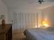 Bedroom with double bed, two lamps, and large closet at 2280 Toniwood Ln, Palm Harbor, FL 34685