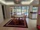 Kitchen dining area with view of the pool and backyard at 2280 Toniwood Ln, Palm Harbor, FL 34685