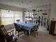 Spacious dining room with a table, chairs, and mirrored shelving at 2280 Toniwood Ln, Palm Harbor, FL 34685