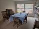 Bright dining room features a table with seating for four and built-in shelving at 2280 Toniwood Ln, Palm Harbor, FL 34685