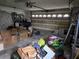 Large garage with overhead door and storage at 2280 Toniwood Ln, Palm Harbor, FL 34685