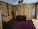 Home office featuring built-in shelving and wood paneling at 2280 Toniwood Ln, Palm Harbor, FL 34685