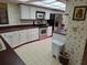 Bright kitchen with ample counter space and breakfast bar at 2280 Toniwood Ln, Palm Harbor, FL 34685
