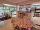 Open kitchen with breakfast nook, bar seating and view into Gathering room at 2280 Toniwood Ln, Palm Harbor, FL 34685