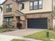 Two-story house with stone accents and a two-car garage at 2588 Bartolo Dr, Land O Lakes, FL 34639