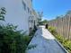 Landscaped backyard with paved pathway at 2602 W Nassau St, Tampa, FL 33607