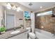 Bathroom features granite countertop, shower and tub at 2602 W Nassau St, Tampa, FL 33607