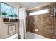 Clean bathroom with shower/tub combo and tile surround at 2602 W Nassau St, Tampa, FL 33607