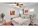 Bedroom with wood floors, mounted TV and decor at 2602 W Nassau St, Tampa, FL 33607
