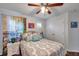 Bedroom with wood floors, ceiling fan and decor at 2602 W Nassau St, Tampa, FL 33607