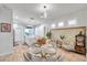 Kitchen and dining area with modern glass table and white chairs at 2602 W Nassau St, Tampa, FL 33607